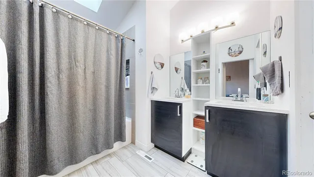 a view of kitchen with stainless steel appliances granite countertop window and sink