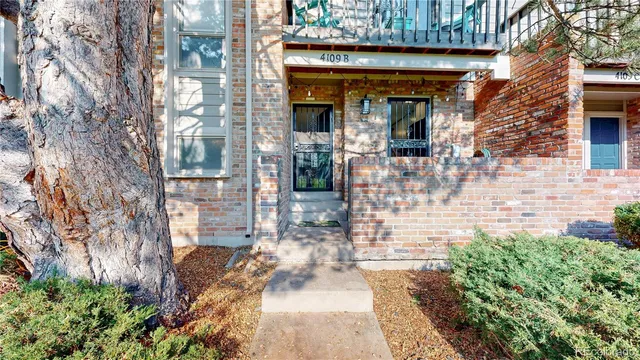 a view of a swimming pool with a big yard and large trees