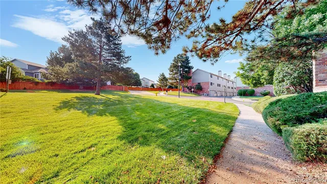 a view of an ocean with a house in the background