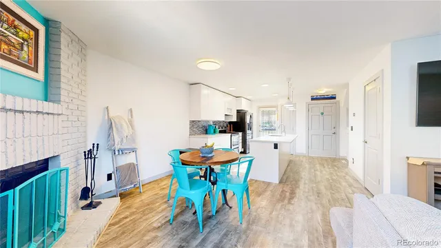 a dining room with furniture and wooden floor