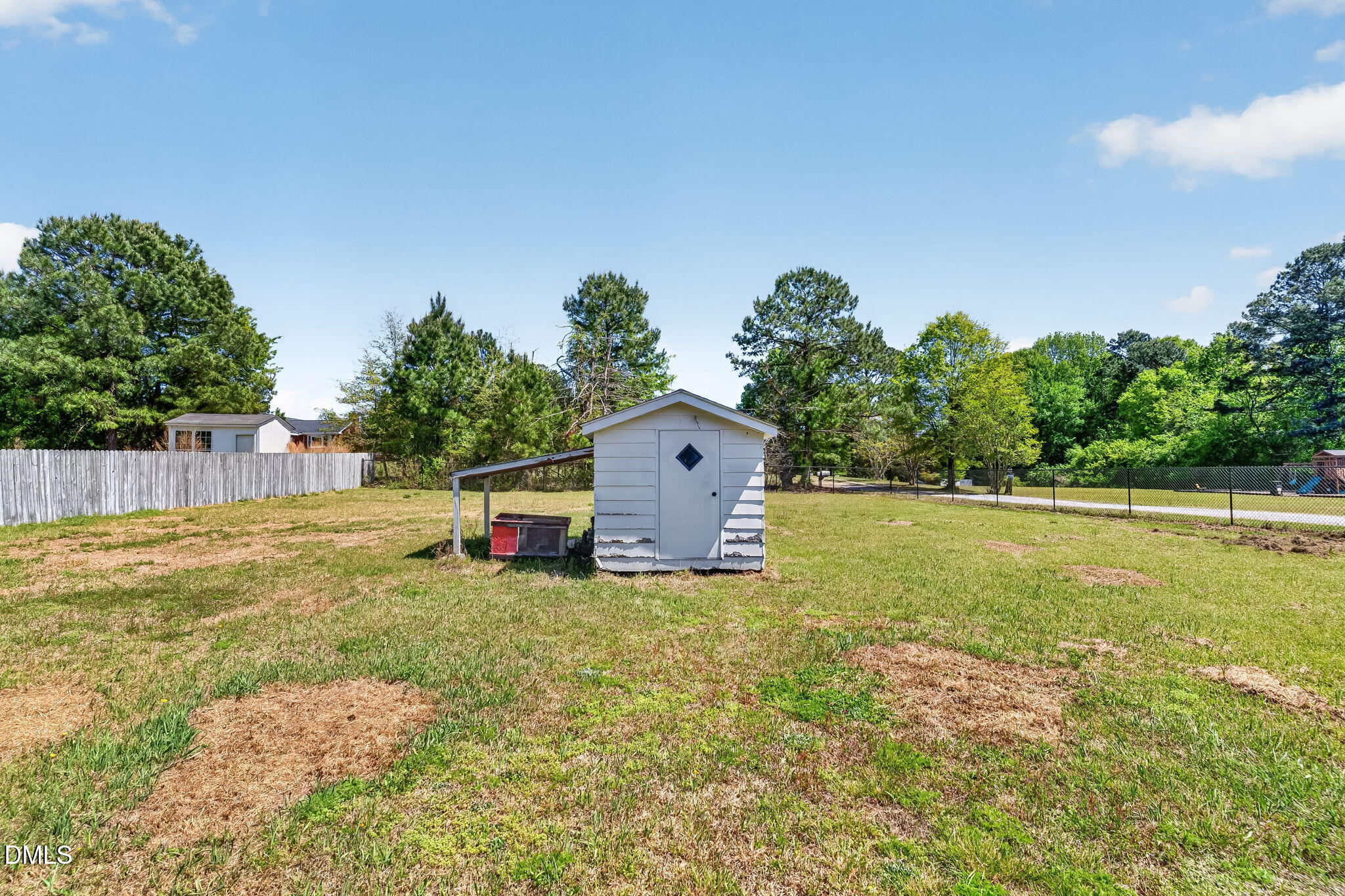 6086 Red Hill Church Road Coats, NC 27521 - Photo 27 of 44 a view of a house with a yard and a large tree