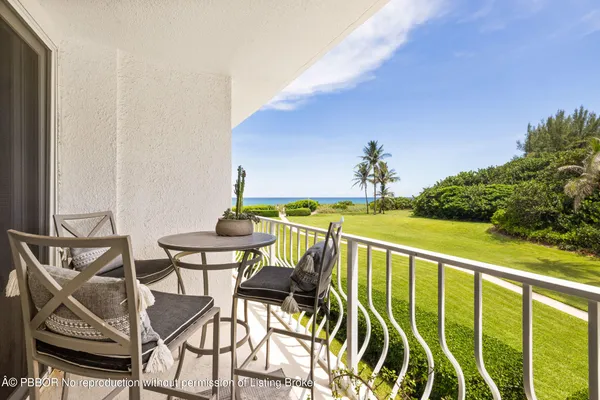 a view of a balcony with chairs