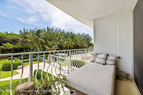 a view of a balcony with chairs