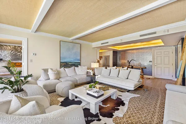 a living room with furniture and a rug