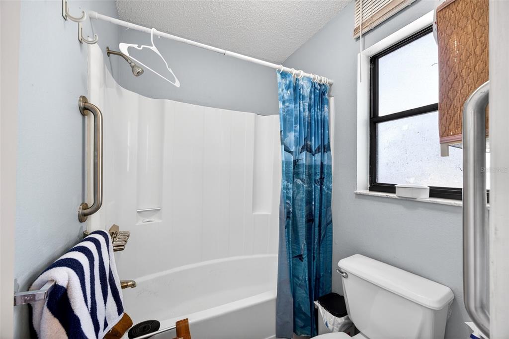 464 Coronado Road Venice, FL 34293 - Photo 15 of 28 a bathroom with a shower and a toilet
