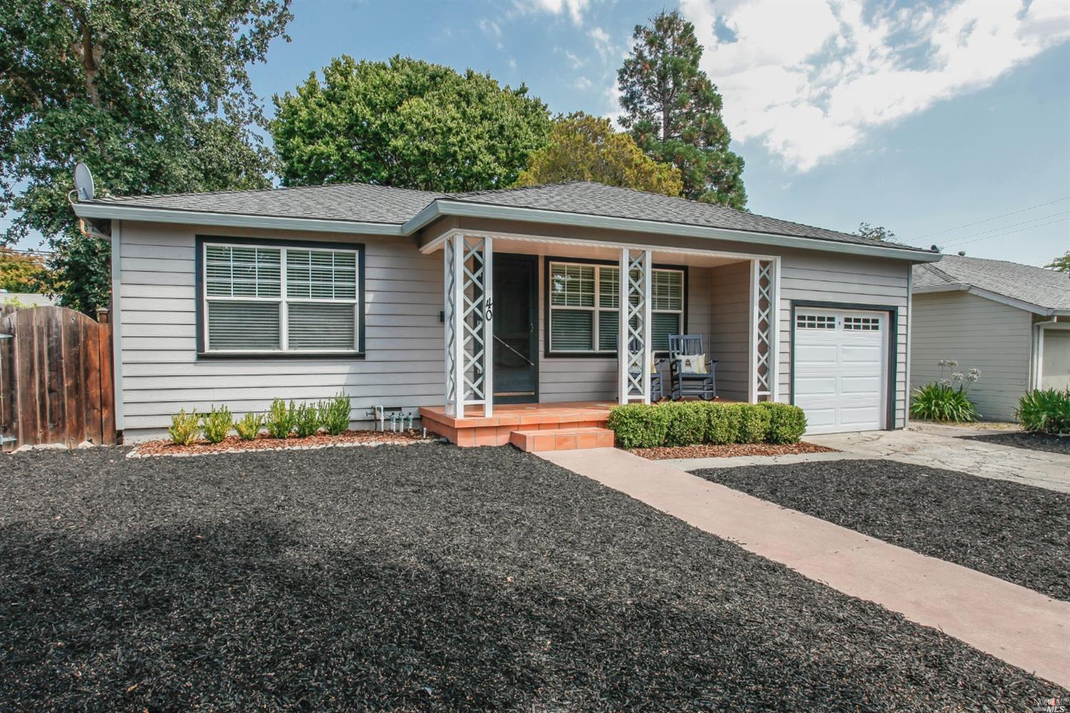 40 Davis Avenue Napa, CA 94559 - Photo 1 of 1 a front view of a house with a yard and potted plants