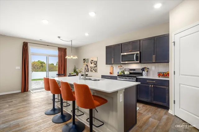 a view of room with furniture and wooden floor