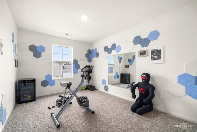 a bedroom with bed and a potted plant