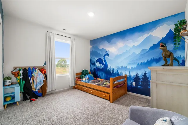 a utility room with lots of clutter and refrigerator