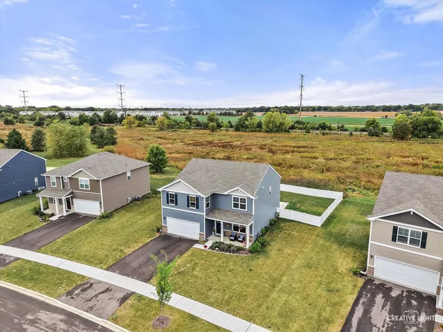 an aerial view of a house with outdoor space