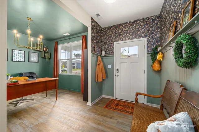 a bed sitting in a room next to a window