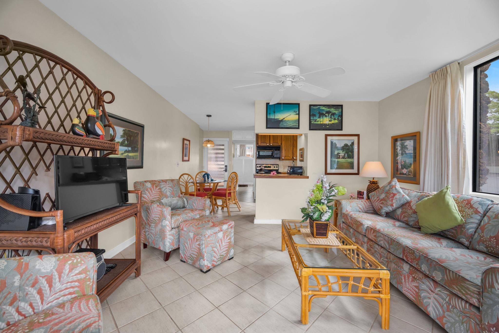 4057 Lower Honoapiilani Road, Unit 116 Lahaina, HI 96761 - Photo 11 of 38 a living room with furniture and a couch