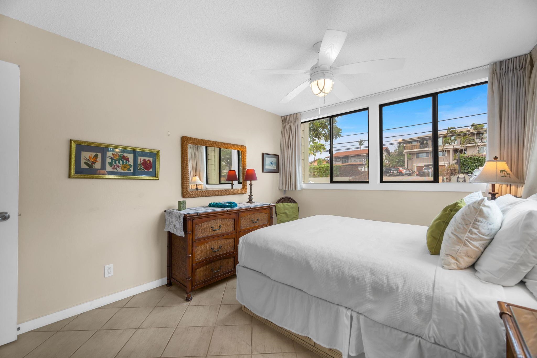 4057 Lower Honoapiilani Road, Unit 116 Lahaina, HI 96761 - Photo 15 of 38 a bedroom with a bed and a couch