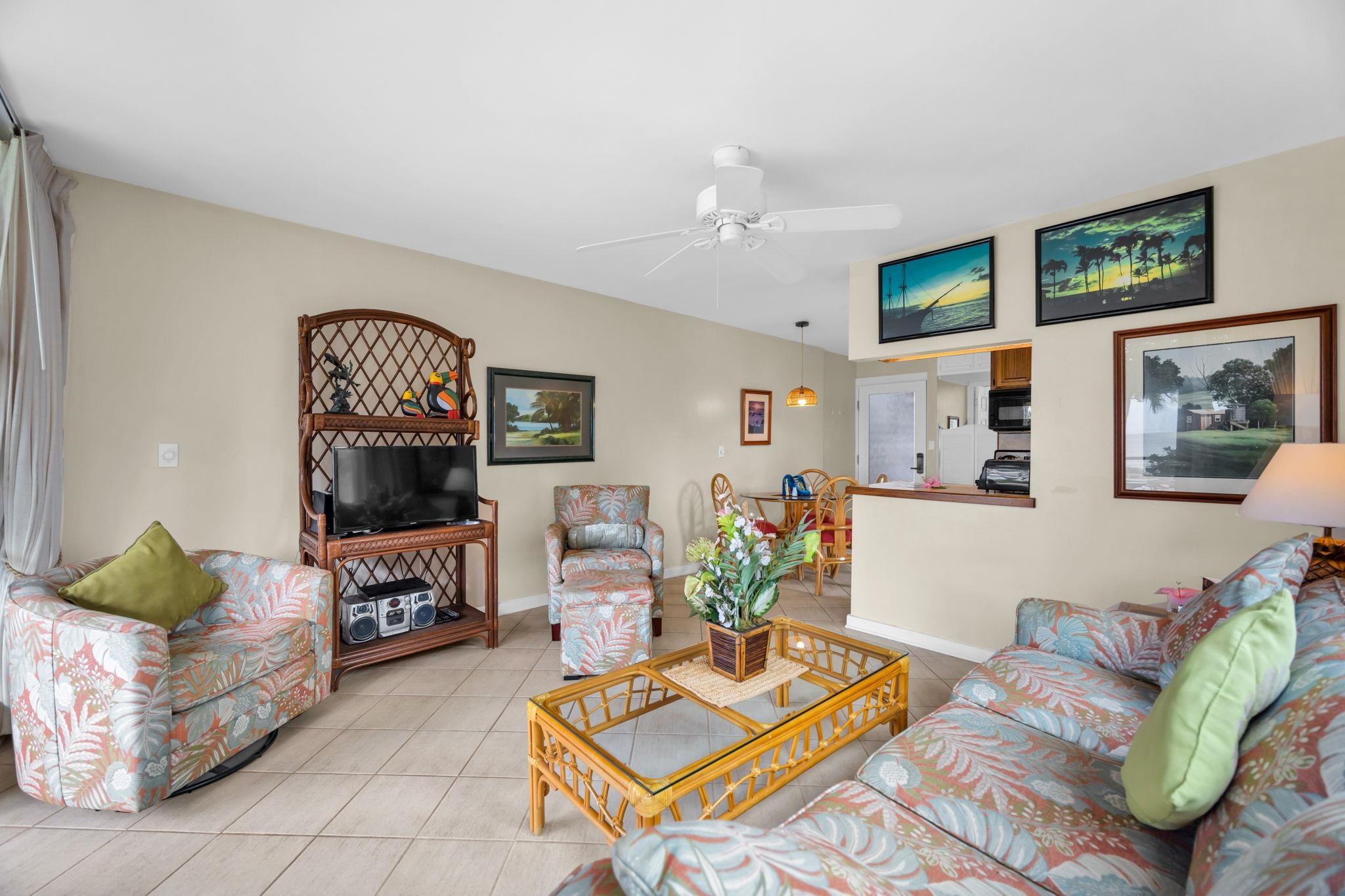 4057 Lower Honoapiilani Road, Unit 116 Lahaina, HI 96761 - Photo 17 of 38 a living room with furniture and wooden floor