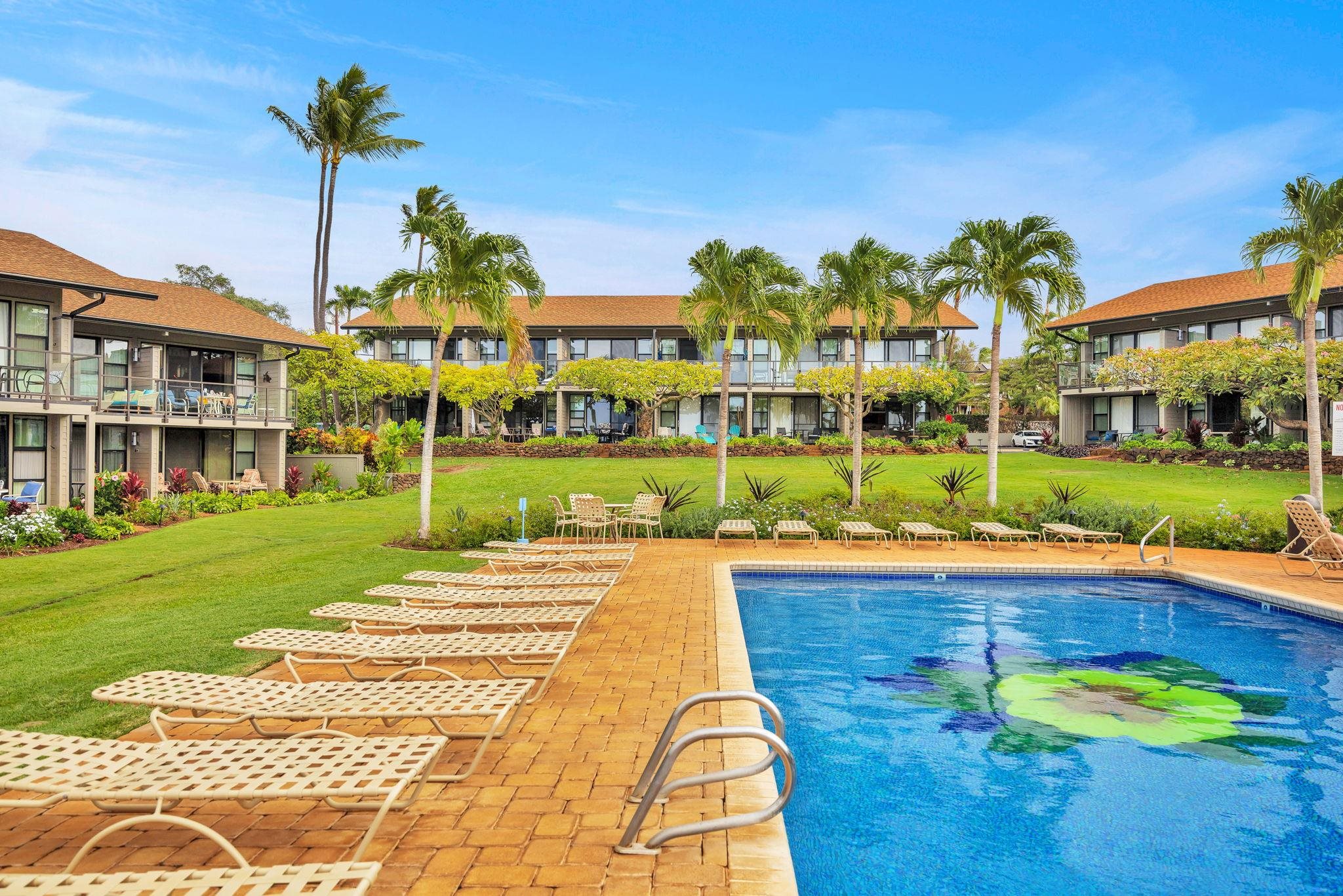 4057 Lower Honoapiilani Road, Unit 116 Lahaina, HI 96761 - Photo 24 of 38 a view of a house with a yard and potted plants