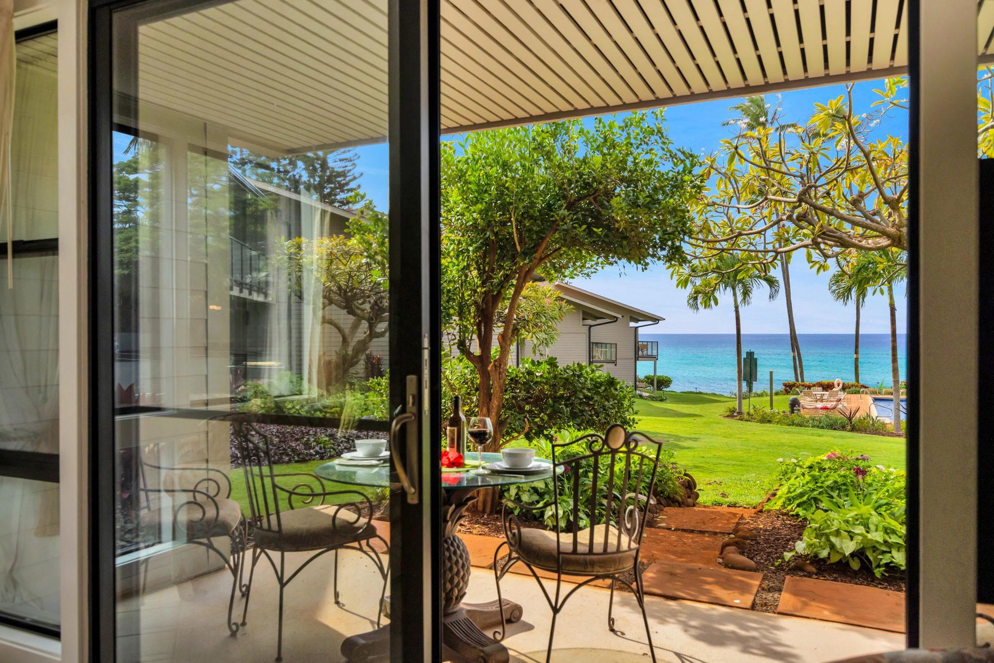 4057 Lower Honoapiilani Road, Unit 116 Lahaina, HI 96761 - Photo 28 of 38 a view of an chairs and table in the patio