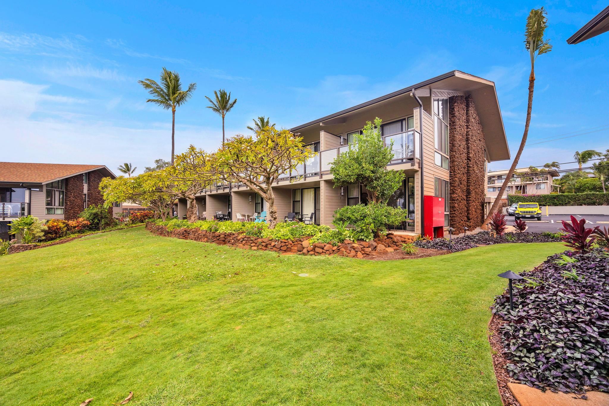 4057 Lower Honoapiilani Road, Unit 116 Lahaina, HI 96761 - Photo 33 of 38 a front view of a house with garden