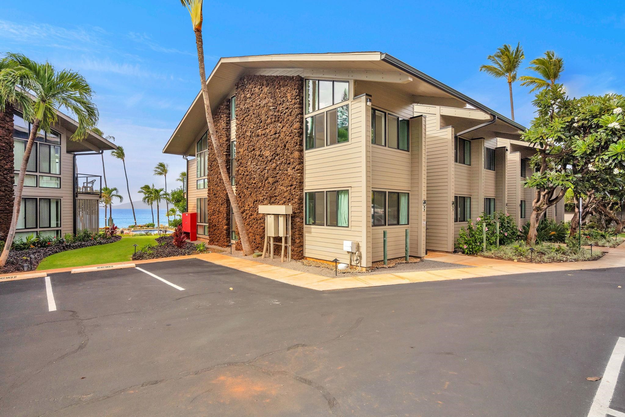 4057 Lower Honoapiilani Road, Unit 116 Lahaina, HI 96761 - Photo 35 of 38 a front view of a house with a yard