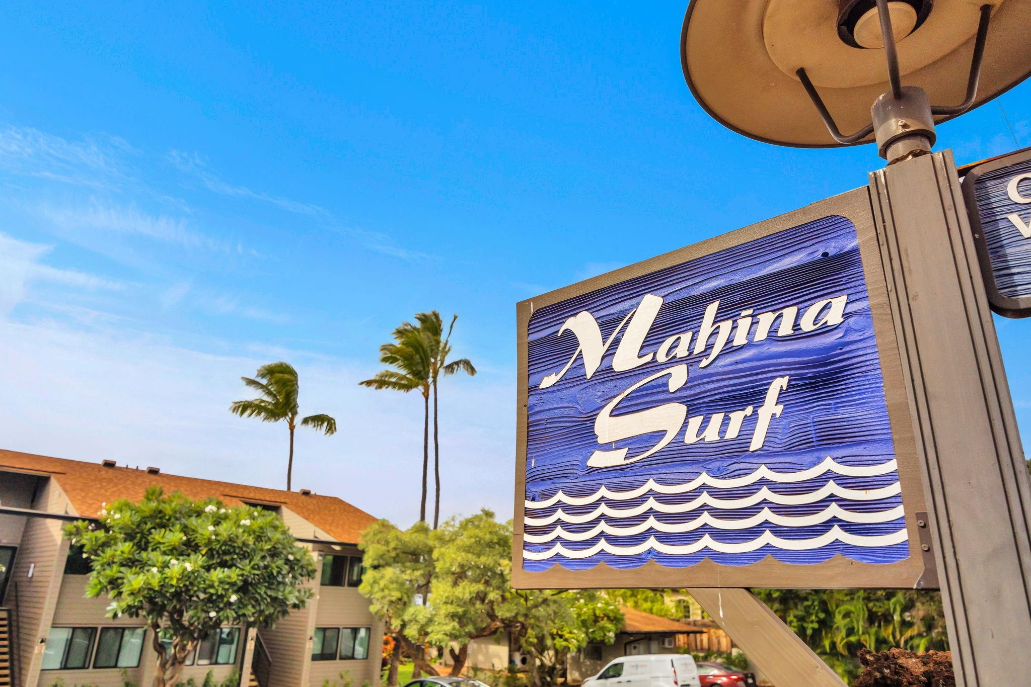 4057 Lower Honoapiilani Road, Unit 116 Lahaina, HI 96761 - Photo 37 of 38 a sign that is on a wall next to a blue wall