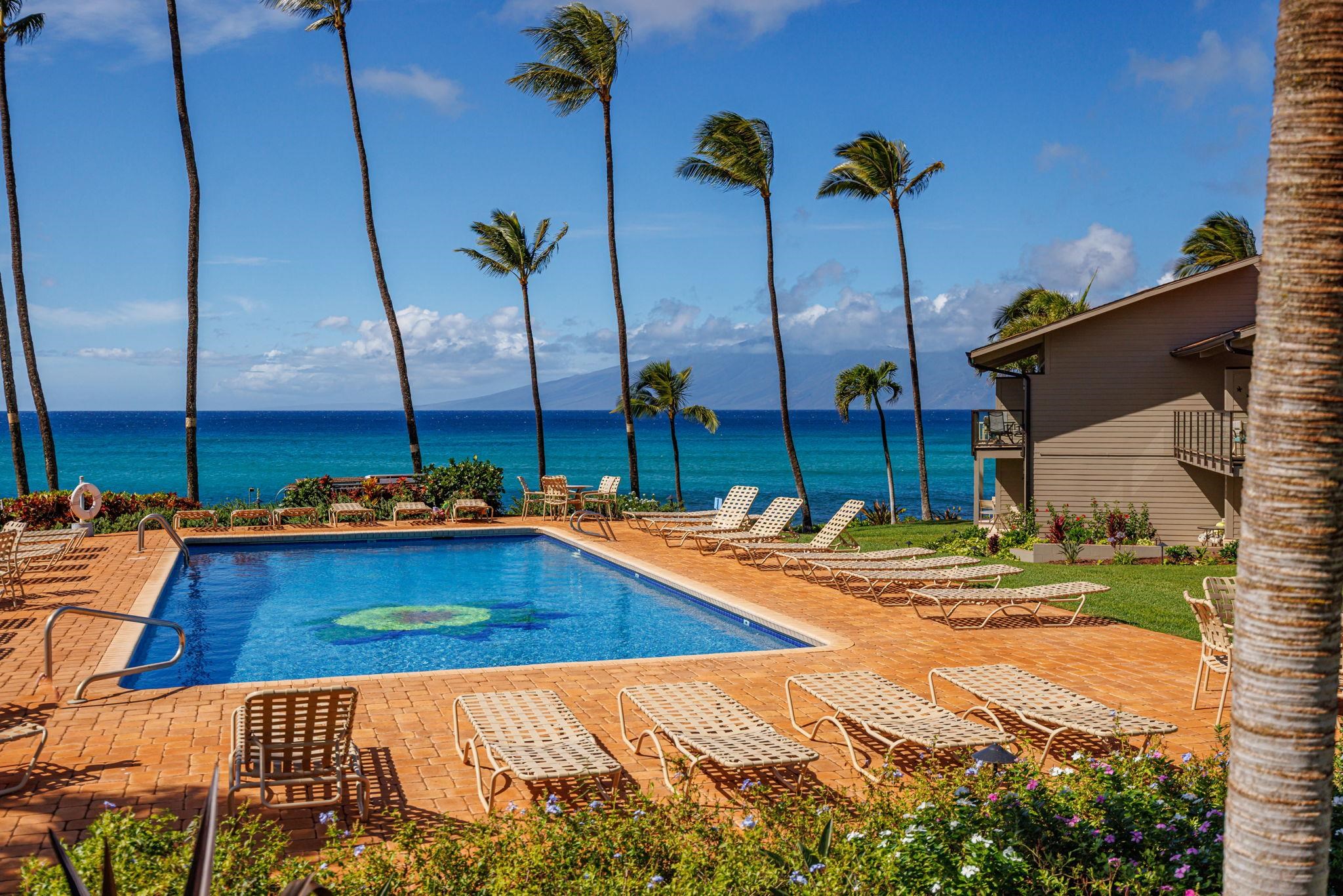 4057 Lower Honoapiilani Road, Unit 116 Lahaina, HI 96761 - Photo 9 of 38 a view of a swimming pool with a chair