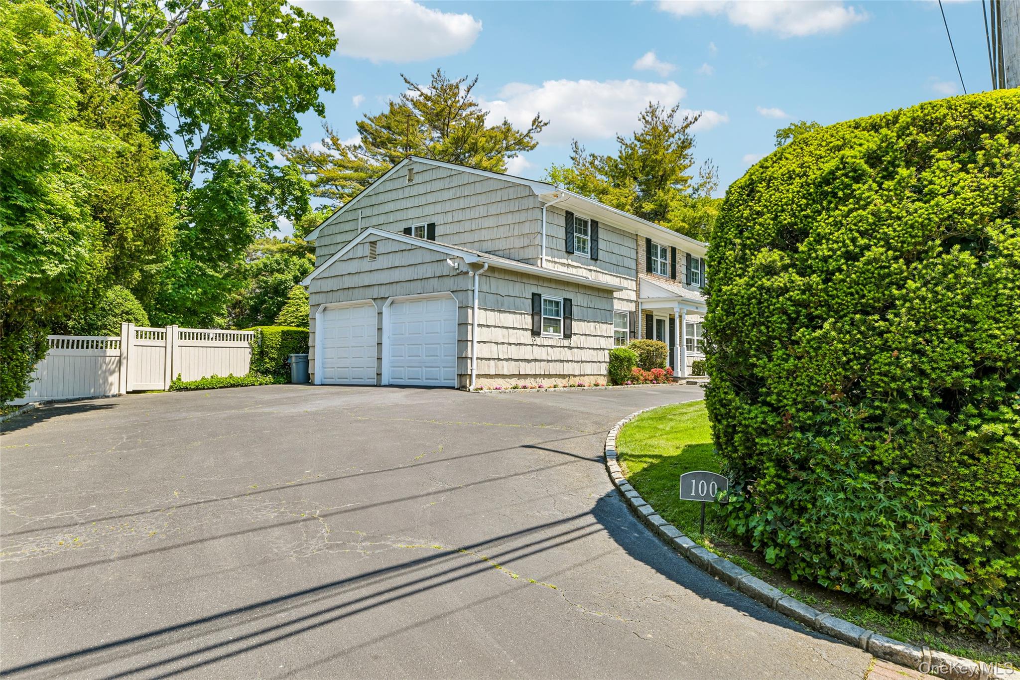100 Hewlett Neck Road Woodmere, NY 11598 - Photo 3 of 45 a house view with a outdoor space