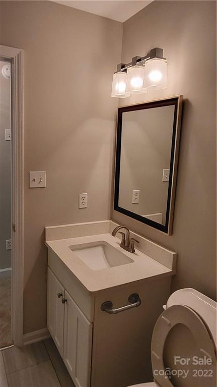 4324 Dye Road Edgemoor, SC 29712 - Photo 22 of 33 a bathroom with a sink vanity and a mirror