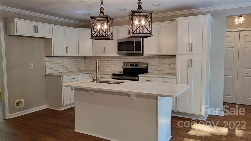 4324 Dye Road Edgemoor, SC 29712 - Photo 5 of 33 a kitchen with stainless steel appliances a sink stove and refrigerator