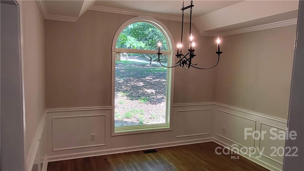 4324 Dye Road Edgemoor, SC 29712 - Photo 8 of 33 a view of a chandelier fan and wooden floor