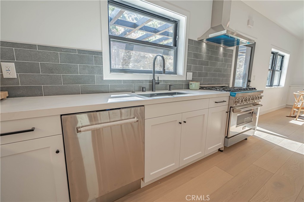 4134 Big Tujunga Canyon Road Tujunga, CA 91042 - Photo 12 of 44 a kitchen with white cabinets and sink