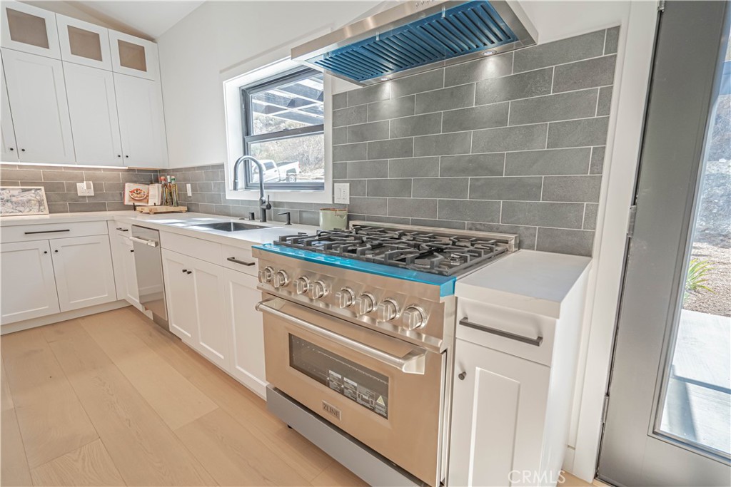 4134 Big Tujunga Canyon Road Tujunga, CA 91042 - Photo 13 of 44 a kitchen with a stove a sink and cabinets