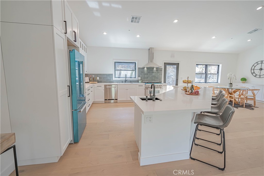 4134 Big Tujunga Canyon Road Tujunga, CA 91042 - Photo 14 of 44 a view of kitchen with kitchen island stainless steel appliances refrigerator stove microwave and cabinets