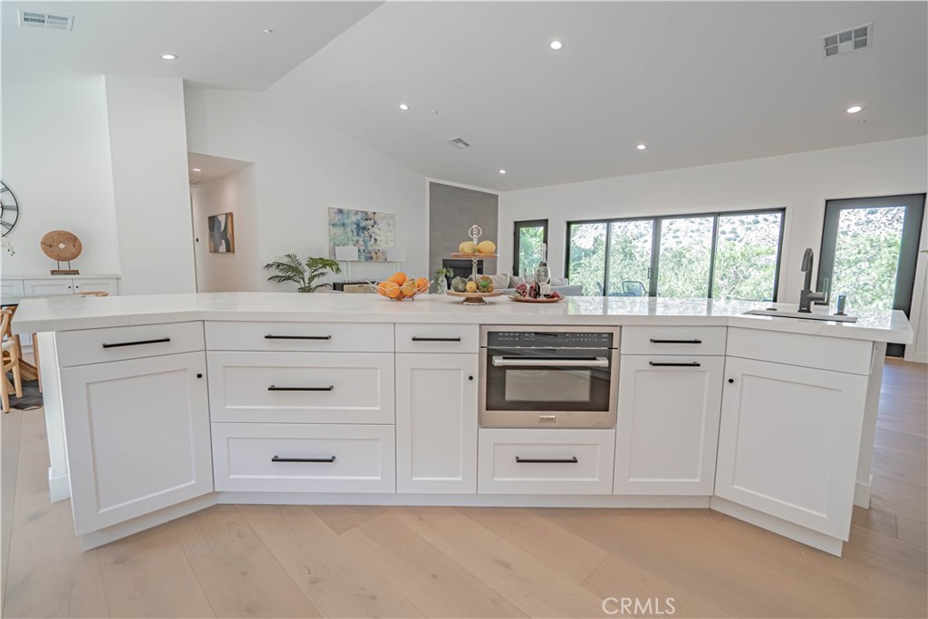 4134 Big Tujunga Canyon Road Tujunga, CA 91042 - Photo 15 of 44 a kitchen with white cabinets and white appliances