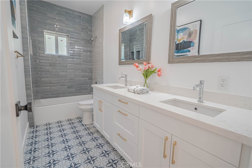 4134 Big Tujunga Canyon Road Tujunga, CA 91042 - Photo 19 of 44 a bathroom with a double vanity sink toilet and shower