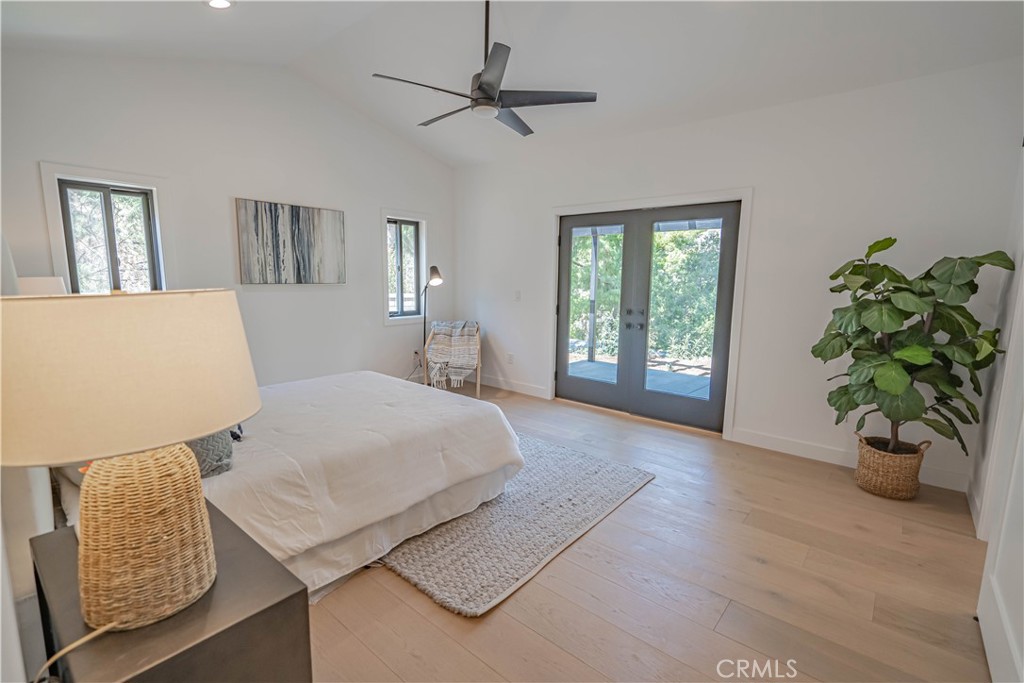 4134 Big Tujunga Canyon Road Tujunga, CA 91042 - Photo 20 of 44 a bedroom with a large bed chandelier and a window