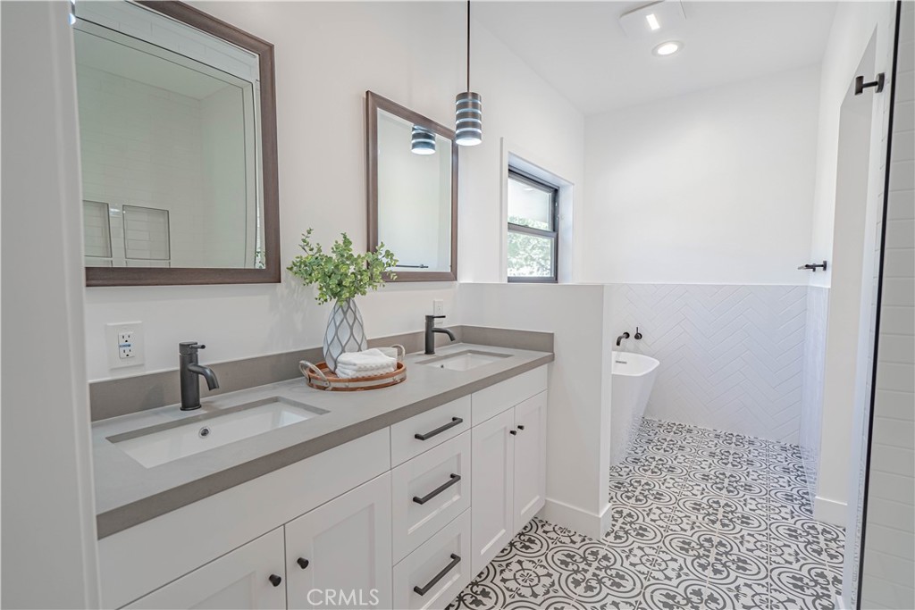 4134 Big Tujunga Canyon Road Tujunga, CA 91042 - Photo 23 of 44 a bathroom with a double vanity sink and a mirror