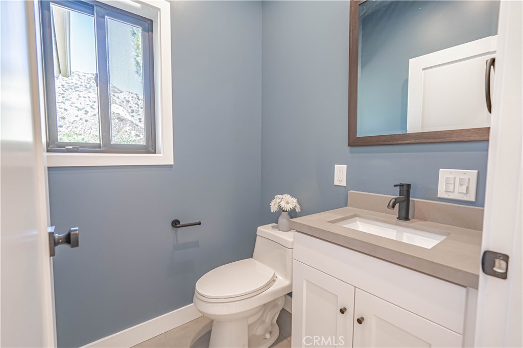 4134 Big Tujunga Canyon Road Tujunga, CA 91042 - Photo 26 of 44 a bathroom with a sink a toilet and a window