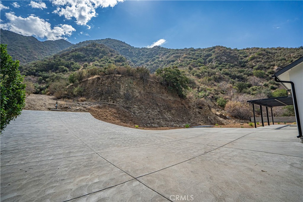 4134 Big Tujunga Canyon Road Tujunga, CA 91042 - Photo 37 of 44 a view of a dry yard with mountains in the background