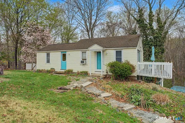 front view of a house with a yard