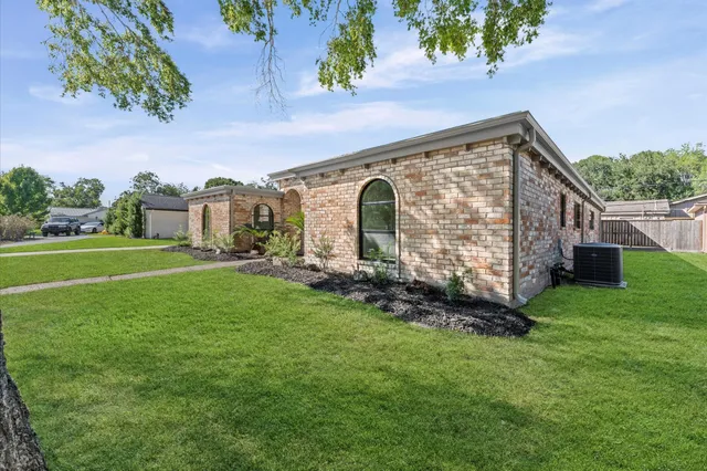 a backyard of a house with lots of green space