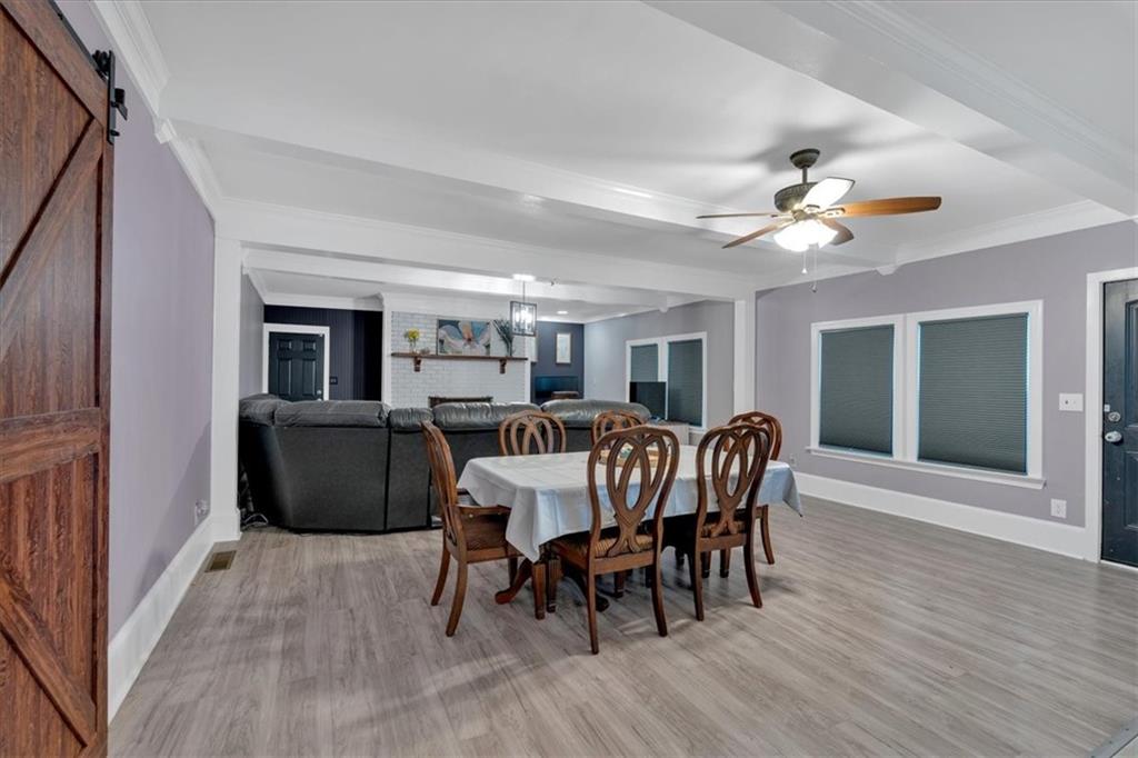 8 South Hughes Street Rome, GA 30165 - Photo 12 of 28 a view of a dining room with furniture window and wooden floor