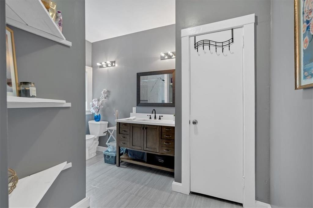 8 South Hughes Street Rome, GA 30165 - Photo 18 of 28 a bathroom with a sink and a mirror
