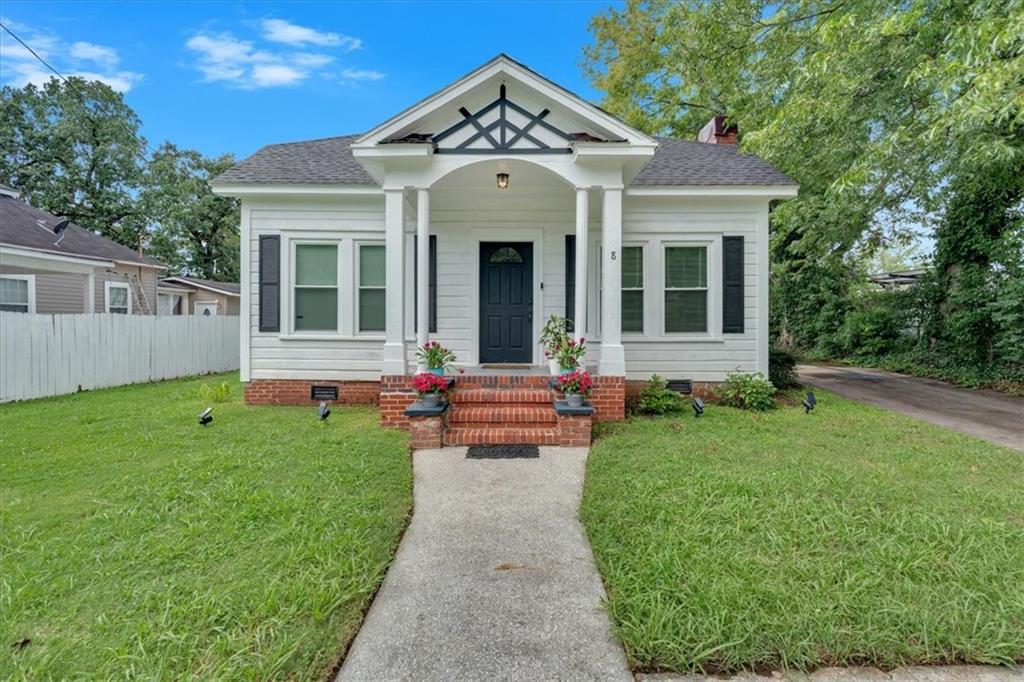 8 South Hughes Street Rome, GA 30165 - Photo 2 of 28 a front view of a house with a yard and porch