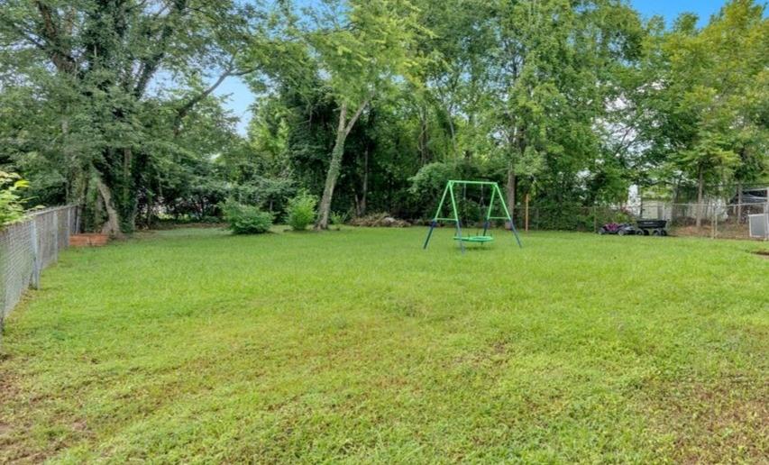 8 South Hughes Street Rome, GA 30165 - Photo 21 of 28 a view of a green field with trees in the background