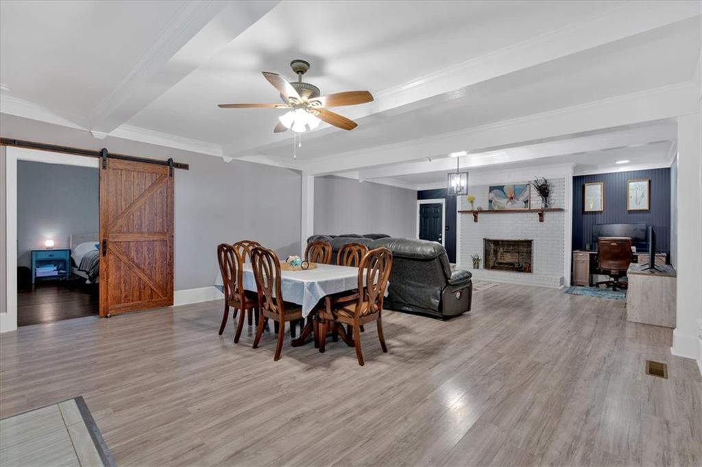 8 South Hughes Street Rome, GA 30165 - Photo 5 of 28 a view of a livingroom with furniture a ceiling fan and wooden floor