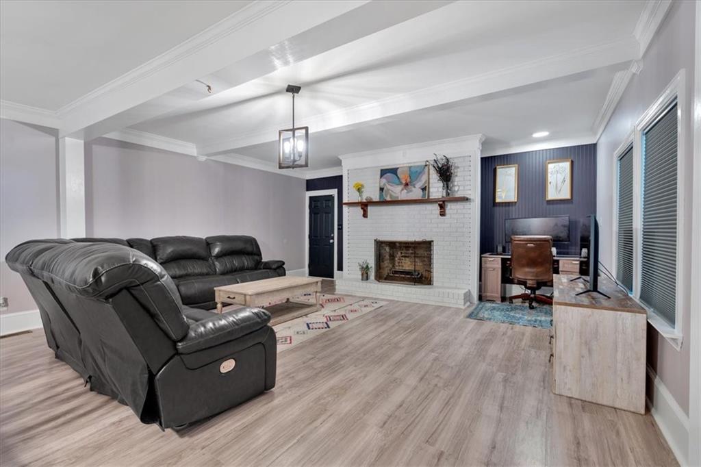 8 South Hughes Street Rome, GA 30165 - Photo 6 of 28 a living room with furniture and a fireplace