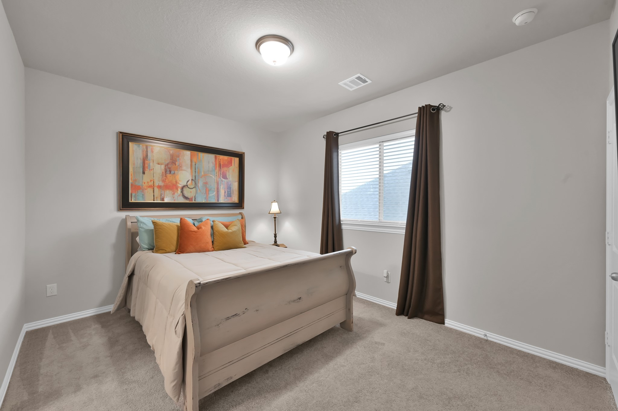 17413 Turtleweed Lane Conroe, TX 77385 - Photo 15 of 27 a bedroom with a bed and a window