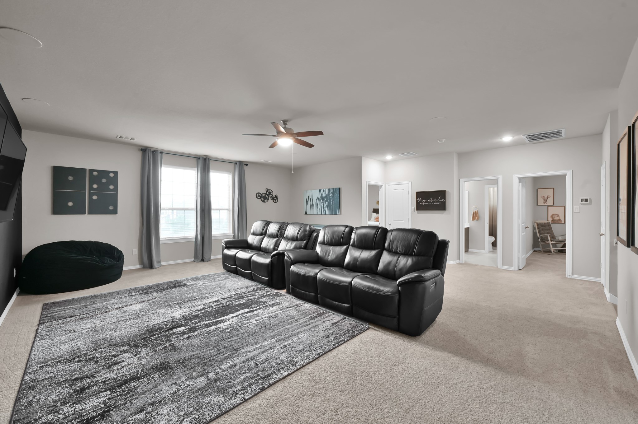 17413 Turtleweed Lane Conroe, TX 77385 - Photo 16 of 27 a living room with furniture and a large mirror