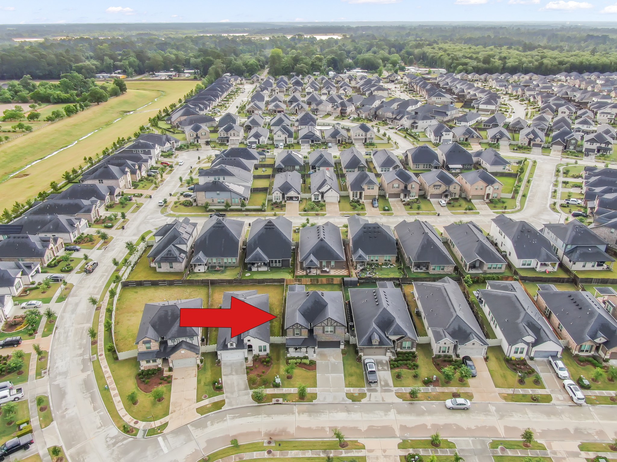 17413 Turtleweed Lane Conroe, TX 77385 - Photo 23 of 27 an aerial view of residential houses with outdoor space