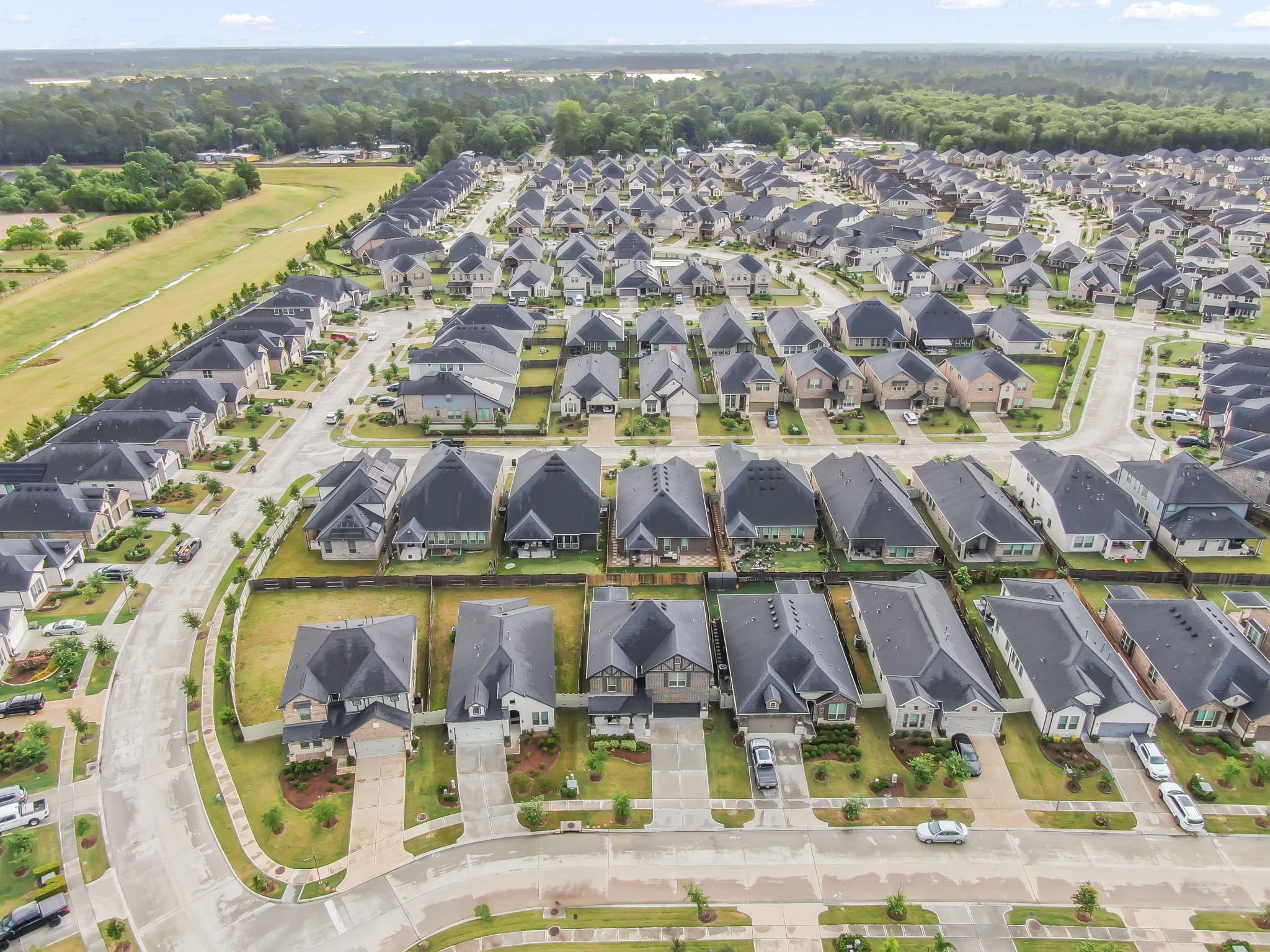 17413 Turtleweed Lane Conroe, TX 77385 - Photo 24 of 27 an aerial view of residential houses with outdoor space