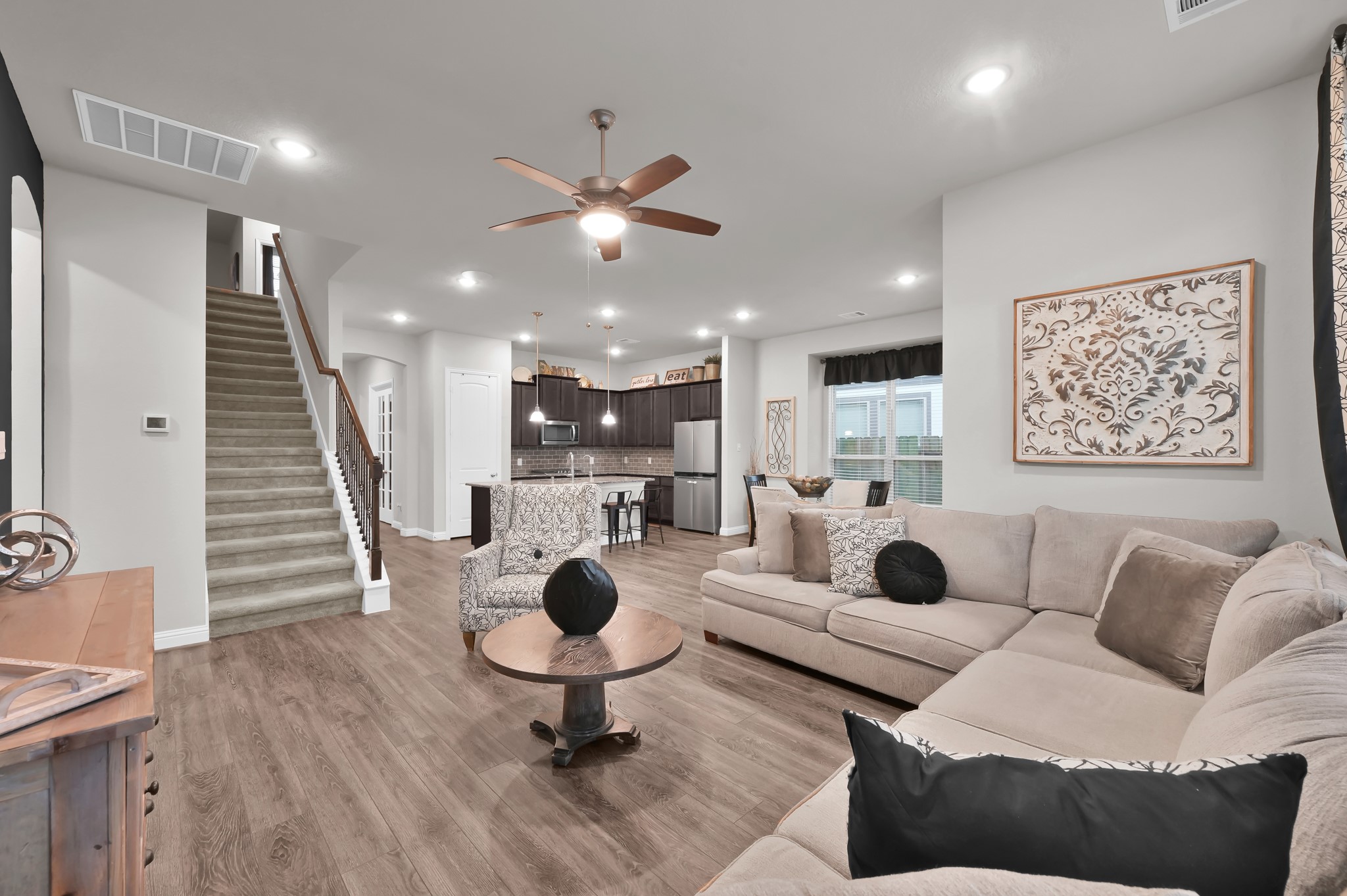 17413 Turtleweed Lane Conroe, TX 77385 - Photo 3 of 27 a living room with furniture and kitchen view